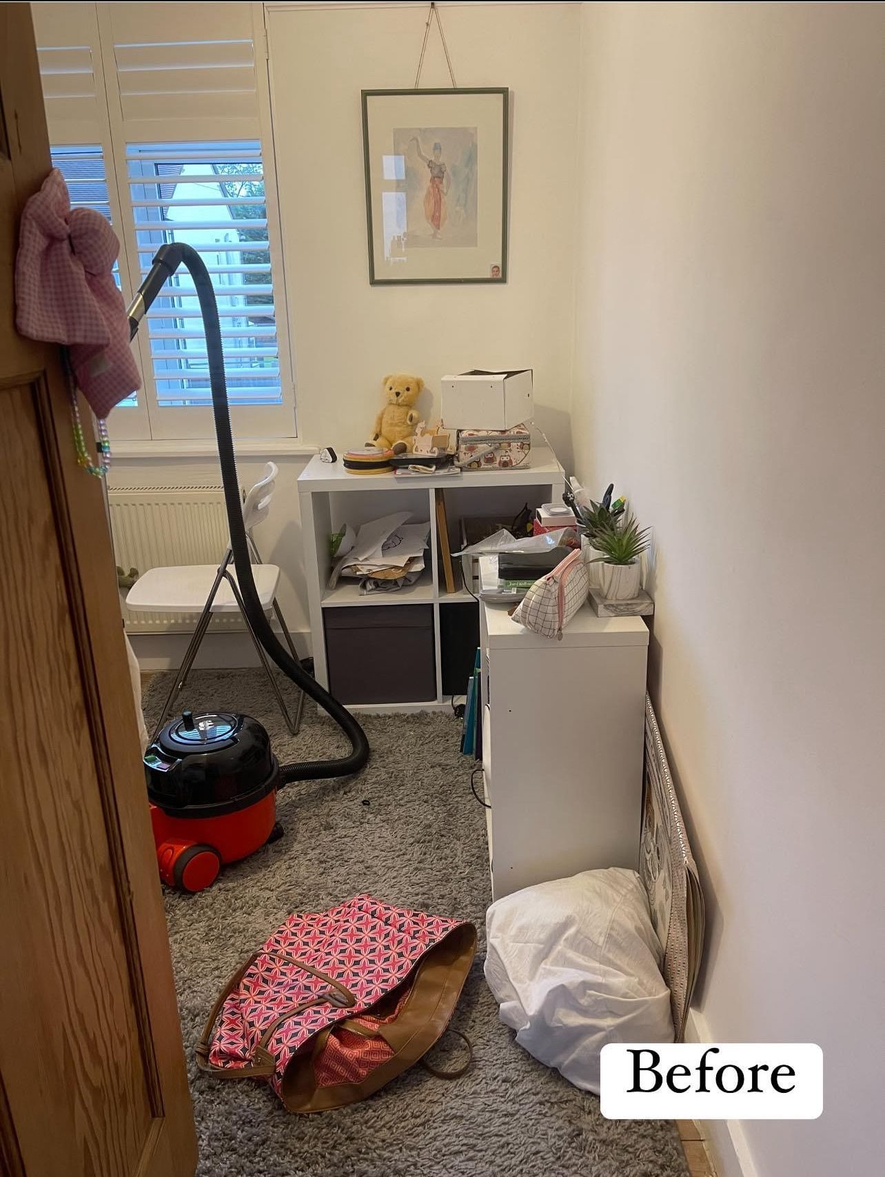 Before: a narrow bedroom with a vacuum cleaner, a bag and a pillow on the floor and a cluttered shelf unit