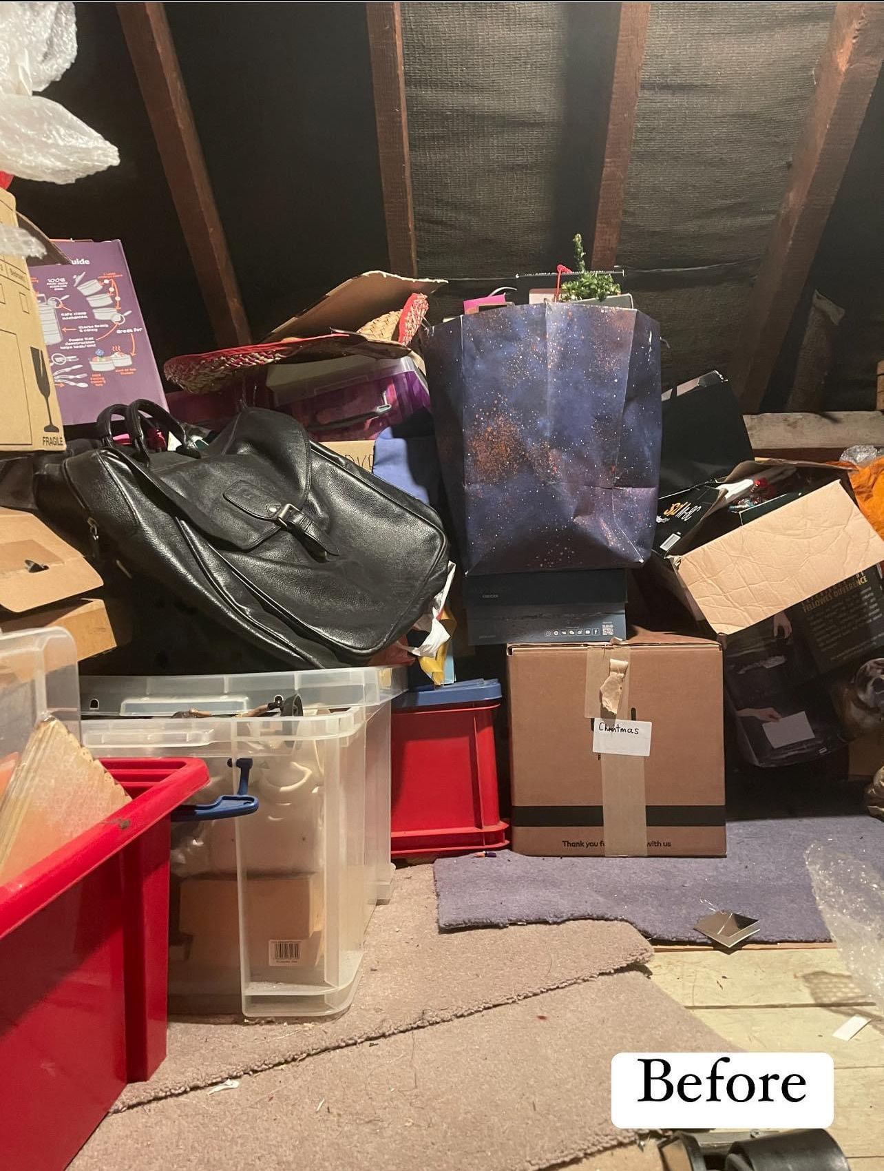 Before: a loft piled with bags, boxes and storage tubs under the rafters