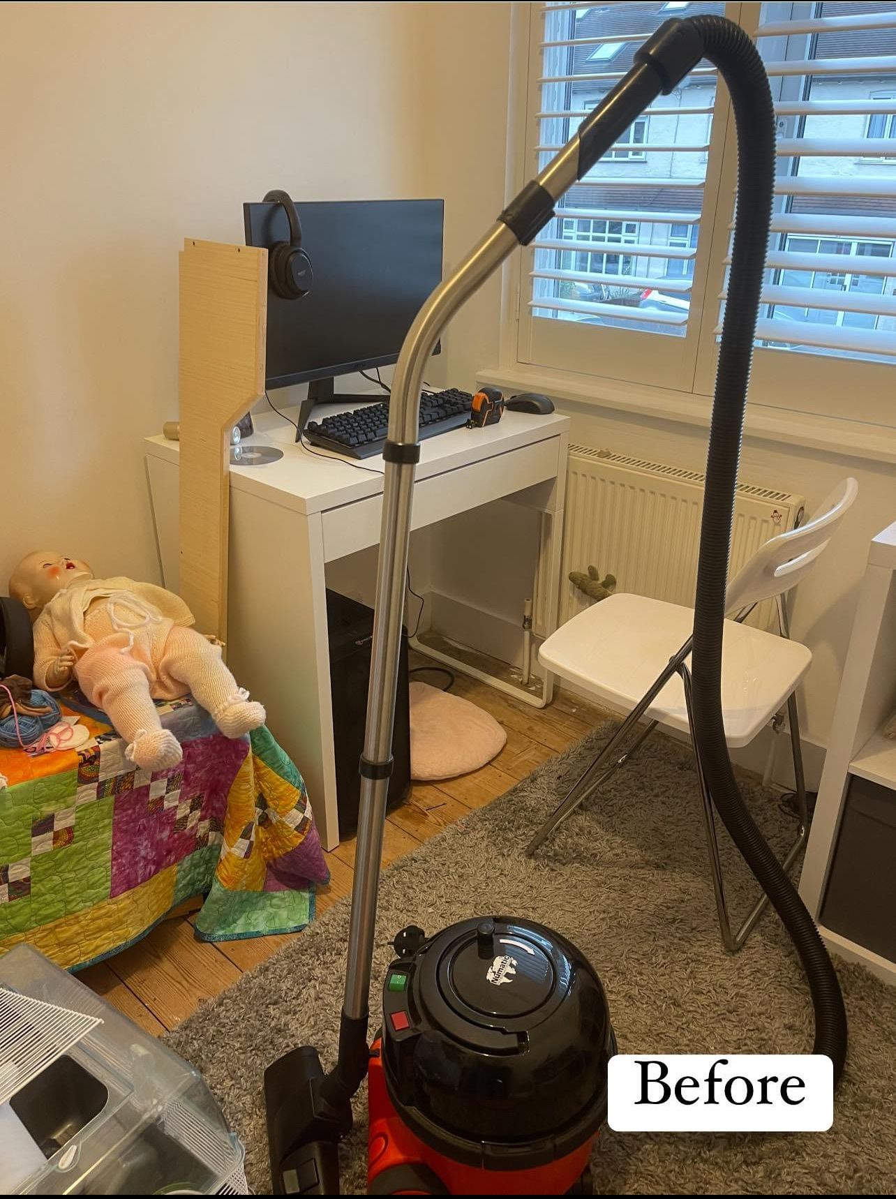 Before: a small office with a vacuum cleaner, a doll on a pile of blankets and boxes around the desk